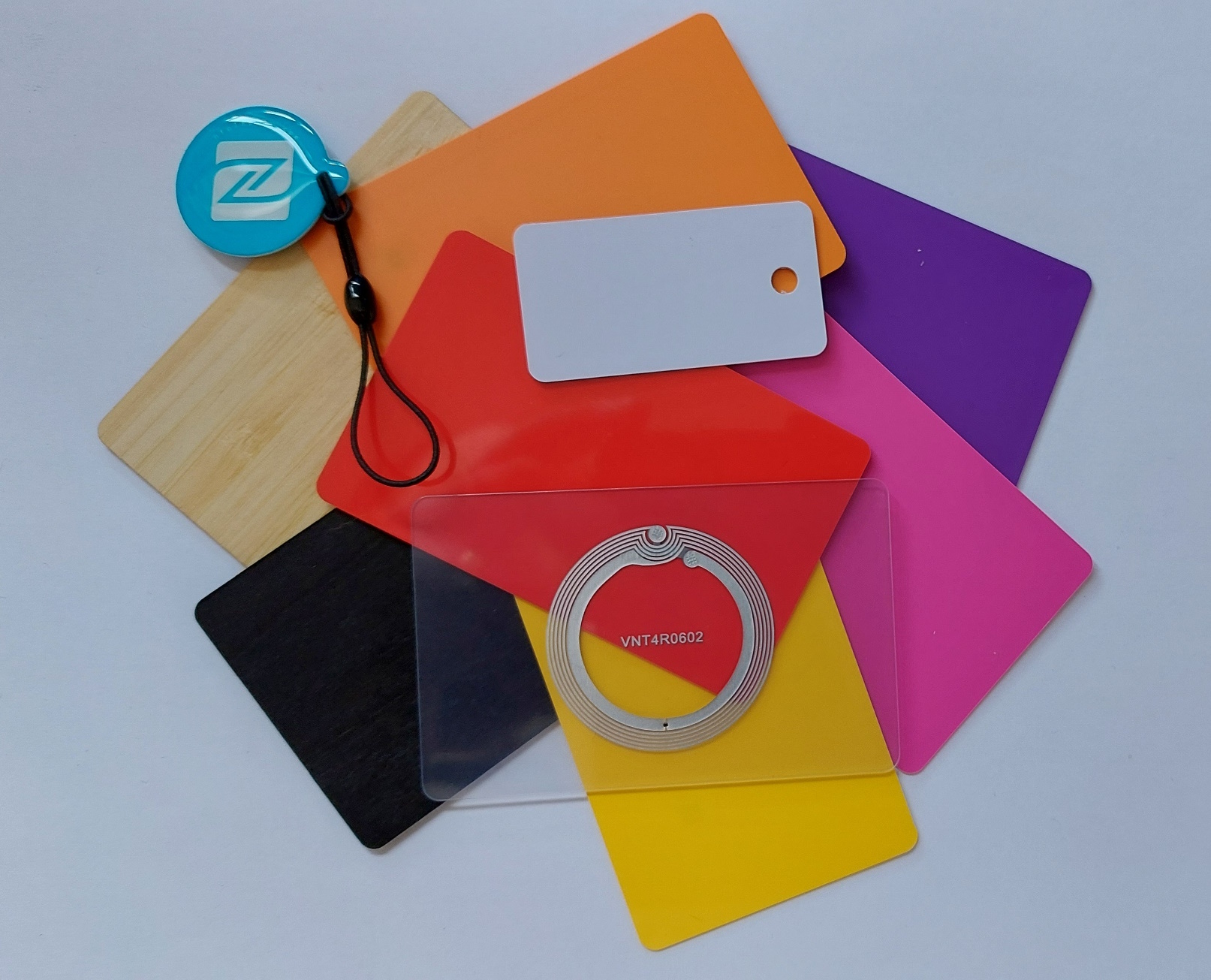 Collection of colourful NFC cards (PVC and Wood) and NFC tags